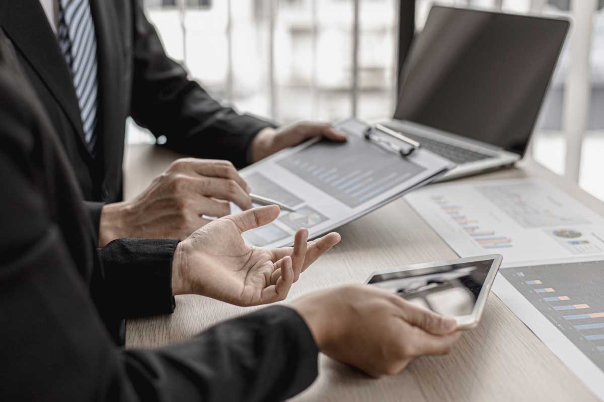 Two Banking Professionals Analysing Lending Report